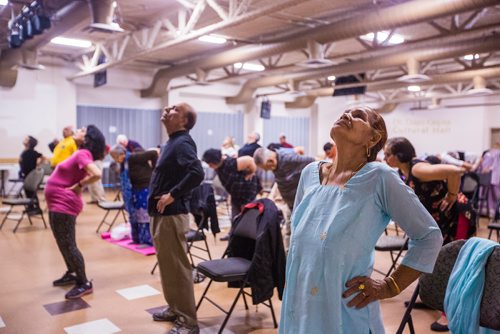 MIKAELA MACKENZIE / WINNIPEG FREE PRESS
Moti Sharma does back bends at the Sharing Circle of Wellness class, where seniors meet weekly for yoga, wellness topics, and lunch, at the Hindu Temple on St. Anne's Road in Winnipeg on Wednesday, May 29, 2019.  For Brenda Suderman story.
Winnipeg Free Press 2019.