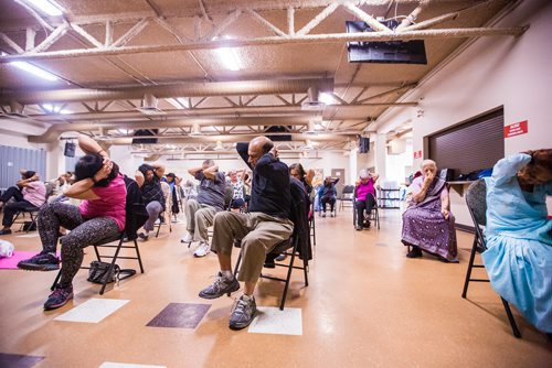 MIKAELA MACKENZIE / WINNIPEG FREE PRESS
Rayesh Misra (left), Bhagchand Misra, and Moti Sharma (all in front row) participate in the Sharing Circle of Wellness class, where seniors meet weekly for yoga, wellness topics, and lunch, at the Hindu Temple on St. Anne's Road in Winnipeg on Wednesday, May 29, 2019.  For Brenda Suderman story.
Winnipeg Free Press 2019.