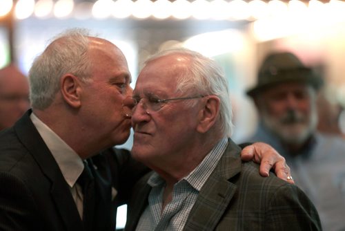 PHIL HOSSACK / WINNIPEG FREE PRESS -  MTC Artistic Director Steven Schipper kisses actor Len Cariou as he mingles at his Gala Farewell at the Royal Manitoba Theatre Centre. See story. - May 29, 2019, 2019.