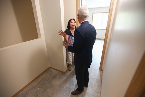 MIKE DEAL / WINNIPEG FREE PRESS 
Merlyn excitedly hugs and thanks John Daniels, Regional Vice-President, Manitoba / Saskatchewan, Qualico, while getting a first time look inside her new home that she will move into with her two sons.
Habitat for Humanity unveiled the almost completed first ever Net Zero construction project, on Logan Avenue Thursday morning.
The four-plex at 1860 Logan Avenue is the first Habitat Net Zero home as well as the first of its kind build project by any builder in Manitoba. These homes should produce as much energy as the homeowner uses.
190530 - Thursday, May 30, 2019.