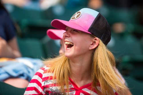 MIKAELA MACKENZIE / WINNIPEG FREE PRESS
Brianne Van Mol, a grade five student, laughs after catching chips while the Goldeyes play against the Gary SouthShore RailCats at Shaw Park in Winnipeg on Thursday, May 30, 2019. 
Winnipeg Free Press 2019.