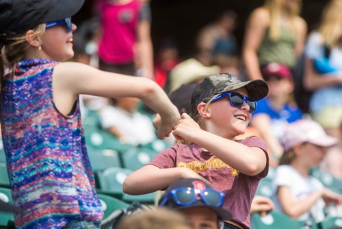 MIKAELA MACKENZIE / WINNIPEG FREE PRESS
Madelyn Eidse (left) and Bryn Labergne dance in the stands as the Goldeyes play against the Gary SouthShore RailCats at Shaw Park in Winnipeg on Thursday, May 30, 2019. 
Winnipeg Free Press 2019.
