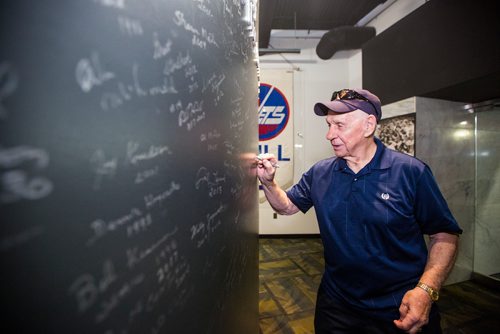 MIKAELA MACKENZIE / WINNIPEG FREE PRESS
Tom McVie, coach of the 1979 Jets team, signs the wall at the Manitoba Sports Hall of Fame, celebrating the 40th anniversary of their Avco Cup championship, in Winnipeg on Friday, May 31, 2019.   For Taylor Allen story.
Winnipeg Free Press 2019.