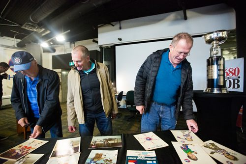 MIKAELA MACKENZIE / WINNIPEG FREE PRESS
Steve West (left), Paul MacKinnon, and Scott Campbell, players from the 1979 Jets team, gather and look at memorabilia at the Manitoba Sports Hall of Fame, celebrating the 40th anniversary of their Avco Cup championship, in Winnipeg on Friday, May 31, 2019.   For Taylor Allen story.
Winnipeg Free Press 2019.