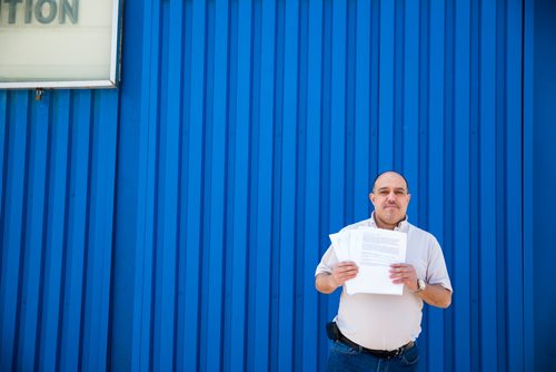 MIKAELA MACKENZIE / WINNIPEG FREE PRESS
Food Fare owner Munther Zeid poses for a portrait with his petition to change the provincial act on store opening hours at Food Fare in Winnipeg on Friday, May 31, 2019.   
Winnipeg Free Press 2019.