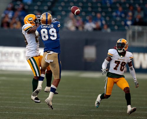 PHIL HOSSACK / WINNIPEG FREE PRESS -Winnipeg Blue Bomber #89 Kenny Lawler is blocked from the pass by Edmonton Eskimo #29 Brian Walker in Pre-Season action at Investor's Group Field Friday. #78 Josh Johnson watches the ball. See story.  -  May 31, 2019.