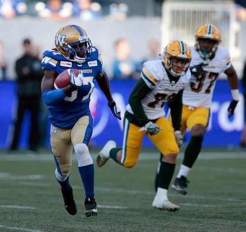 PHIL HOSSACK / WINNIPEG FREE PRESS -Winnipeg Blue Bomber #87 Lucky Whitehead scampers a kickoff return around Edmonton Eskimos #79 Jamr King and #37 Oshane Samuels in Pre-Season action at Investor's Group Field Friday. See story.  - May 31, 2019.