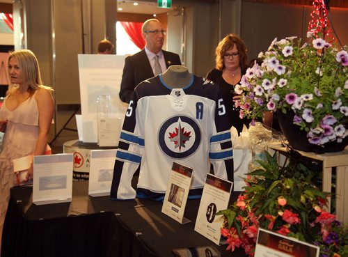 JASON HALSTEAD / WINNIPEG FREE PRESS

Attendees check out silent auction items at the 2019 Gold Heart Gala hosted by Variety, the Childrens Charity of Manitoba, on May 4, 2019 at the RBC Convention Centre Winnipeg. (See Social Page)