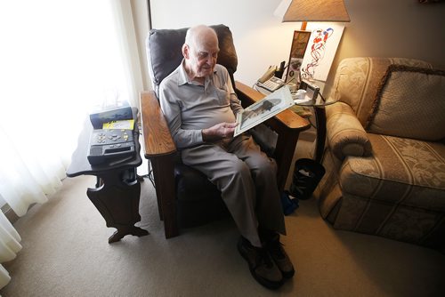 JOHN WOODS / WINNIPEG FREE PRESS
Jim Magill, a Royal Canadian Air Force veteran, is photographed as he looks at a portrait of himself in his Winnipeg home Wednesday, May 29, 2019. He was in the air during D-Day.

Reporter: Kevin Rollason