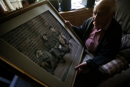 JOHN WOODS / WINNIPEG FREE PRESS
Len Van Roon, D-Day veteran, is photographed in his Charleswood home Wednesday, May 29, 2019 as he looks at a photo of himself and some local boys taken a couple of days before the battle. 

Reporter: Kevin Rollason