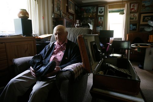 JOHN WOODS / WINNIPEG FREE PRESS
Len Van Roon, D-Day veteran, is photographed in his Charleswood home Wednesday, May 29, 2019 as he looks at the boots he wore on the beach during the battle. 

Reporter: Kevin Rollason