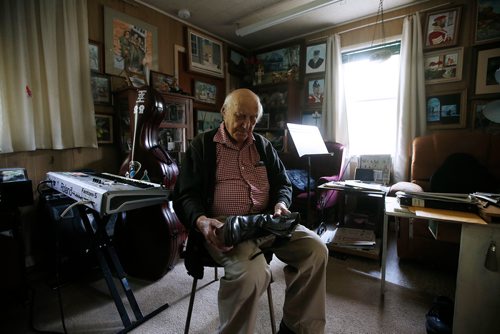 JOHN WOODS / WINNIPEG FREE PRESS
Len Van Roon, D-Day veteran, is photographed in his Charleswood home Wednesday, May 29, 2019 as he looks at the boots he wore on the beach during the battle. 

Reporter: Kevin Rollason