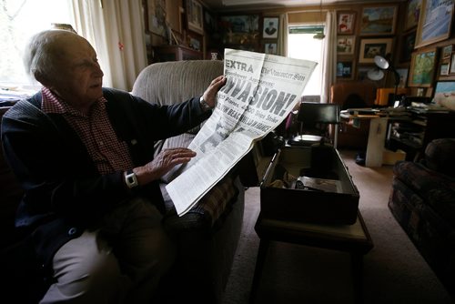 JOHN WOODS / WINNIPEG FREE PRESS
Len Van Roon, D-Day veteran, is photographed in his Charleswood home Wednesday, May 29, 2019 as he looks at a newspaper which described the battle. 

Reporter: Kevin Rollason