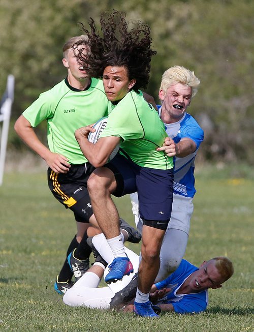JOHN WOODS / WINNIPEG FREE PRESS
Hassan Nassar, centre, of Dakota Collegiate and his team outplayed Oak Park to win the Winnipeg High School 7s Rugby Championship at Maple Grove Rugby Park in Winnipeg Monday, June 3, 2019. Dakota defeated Oak Park 33-17.

Reporter: standup