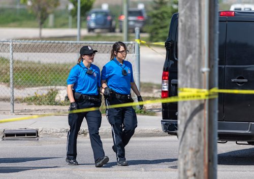 SASHA SEFTER / WINNIPEG FREE PRESS
Two Winnipeg Police Service Cadets hold hands as they leave the scene of a fatal accident involving a truck and a cyclist on Higgins Avenue between Princess and King Streets.
190604 - Tuesday, June 04, 2019.
