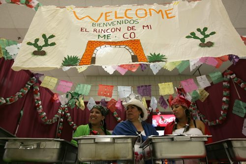 Brandon Sun From left: Jennyfer Zavala, Marla Zavala and Perla Yessinia Mendoza ready the Mexican booth at the Multicultural Marketplace in the UCT Pavilion, Wednesday afternoon during the Summer Fair. (Colin Corneau/Brandon Sun)