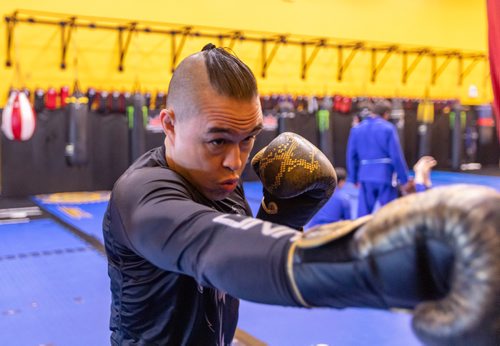 SASHA SEFTER / WINNIPEG FREE PRESS
Derek Pang suffered a traumatic brail injury in 2010 and was in a coma for three and a half days. Pang warms up by hitting a punching bag at the Canadian Fighting Centre. See Sabrina Carnevale story
190605 - Wednesday, June 05, 2019.