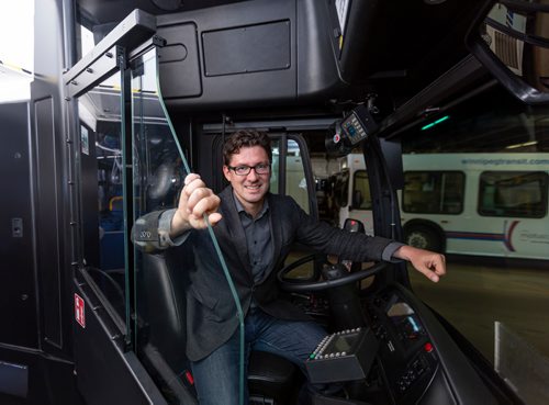 SASHA SEFTER / WINNIPEG FREE PRESS
Councillor Matt Allard, Chair of the Standing Policy Committee on Infrastructure Renewal and Public Works sits in a bus with a safety shield during a press conference to showcase newly-installed bus operator safety shields at the Winnipeg Transit Brandon Garage.
190606 - Thursday, June 06, 2019.