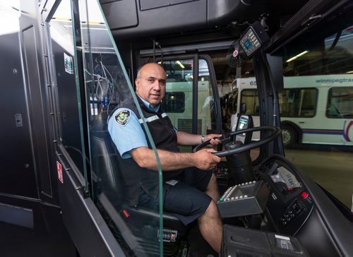 SASHA SEFTER / WINNIPEG FREE PRESS
Transit Operator Angel Valazquez sits in a bus with a safety shield during a press conference to showcase newly-installed bus operator safety shields at the Winnipeg Transit Brandon Garage.
190606 - Thursday, June 06, 2019.