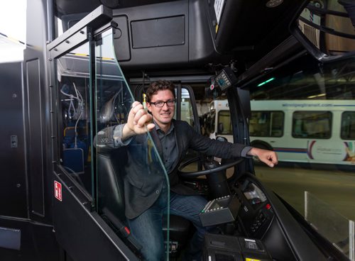 SASHA SEFTER / WINNIPEG FREE PRESS
Councillor Matt Allard, Chair of the Standing Policy Committee on Infrastructure Renewal and Public Works sits in a bus with a safety shield during a press conference to showcase newly-installed bus operator safety shields at the Winnipeg Transit Brandon Garage.
190606 - Thursday, June 06, 2019.