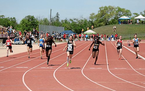 SASHA SEFTER / WINNIPEG FREE PRESS
Peighton Johnson (middle) crosses the finish line in first place during her 100m race heat at the MHSAA Provincial Track and Field meet held on the University of Manitoba campus.
190606 - Thursday, June 06, 2019.