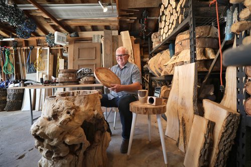 RUTH BONNEVILLE /  WINNIPEG FREE PRESS 

INTERSECTION - Treevival

 Intersection piece on Weldon Neufeld, owner of Treevival, a woodworking biz that turns diseased and cut-down trees into home decor & furniture, everything from speaker amps for phones to patio furniture. 

Weldon Neufeld, in his 60s, has been a carpenter for years; six years ago he started his biz, marketing his wares at farmers' markets and independent businesses thru-out the city. He's super resourceful when it comes to his raw materials - he's been known to pull stumps-as-driftwood out of riverbanks, and refers to himself as an arborist-chaser (if a tree service cuts down a tree and the homeowner doesn't want the wood, he'll gladly take it off their hands)

Portraits of him in his garage-workshop - both showing off his products and wood that's waiting to be transformed into his next piece.


Dave Sanderson story 


June 6th, 2019

