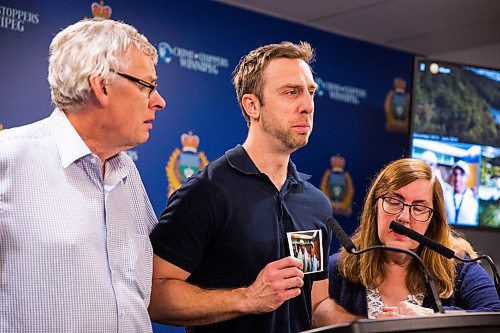 MIKAELA MACKENZIE / WINNIPEG FREE PRESS
Michael Silicz, brother of the victim, reads a statement with parents Walter (left) and Nicole Silicz at a media briefing about the homicide of Justin Silicz at the police headquarters in Winnipeg on Friday, June 7, 2019. For Katie May story.  
Winnipeg Free Press 2019.