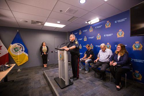 MIKAELA MACKENZIE / WINNIPEG FREE PRESS
Constable Rob Carver speaks at a media briefing about the homicide of Justin Silicz while constable Tammy Skrabek (left) and family members Michael, Walter, and Nicole Silicz listen at the police headquarters in Winnipeg on Friday, June 7, 2019. For Katie May story.  
Winnipeg Free Press 2019.