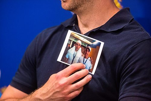 MIKAELA MACKENZIE / WINNIPEG FREE PRESS
Michael Silicz holds a picture of him and his brother, Justin Silicz, at a media briefing about the homicide of Justin Silicz at the police headquarters in Winnipeg on Friday, June 7, 2019. For Katie May story.  
Winnipeg Free Press 2019.