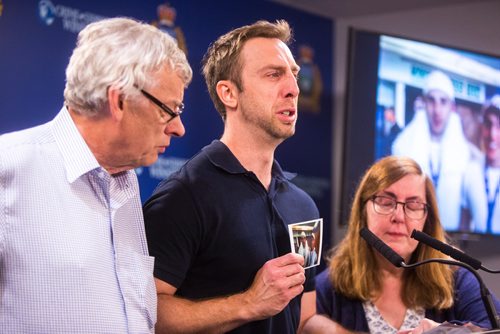 MIKAELA MACKENZIE / WINNIPEG FREE PRESS
Michael Silicz, brother of the victim, reads a statement with parents Walter (left) and Nicole Silicz at a media briefing about the homicide of Justin Silicz at the police headquarters in Winnipeg on Friday, June 7, 2019. For Katie May story.  
Winnipeg Free Press 2019.