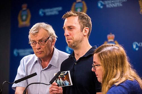 MIKAELA MACKENZIE / WINNIPEG FREE PRESS
Michael Silicz, brother of the victim, reads a statement with parents Walter (left) and Nicole Silicz at a media briefing about the homicide of Justin Silicz at the police headquarters in Winnipeg on Friday, June 7, 2019. For Katie May story.  
Winnipeg Free Press 2019.