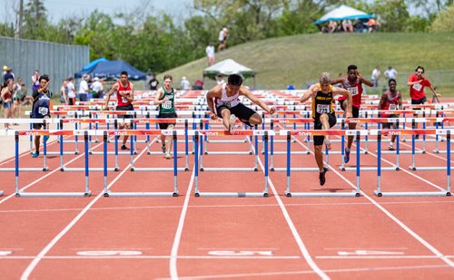 SASHA SEFTER / WINNIPEG FREE PRESS
Michael Sliverie of Sisler High School placed 1st in a Varsity Boys preliminary 100m hurdles race during the MHSAA Provincial Track and Field meet held on the University of Manitoba campus.
190607 - Friday, June 07, 2019.