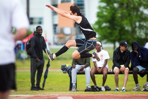 MIKAELA MACKENZIE / WINNIPEG FREE PRESS
Darian Dobrescu does the triple jump in the senior boys at the MHSAA Dairy Farmers of Manitoba Track & Field Championships at University Stadium in Winnipeg on Saturday, June 8, 2019. For Devon story.  
Winnipeg Free Press 2019.