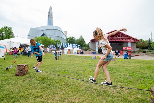 Mike Sudoma / Winnipeg Free Press
Landon (left) and his sister Miley (right) on the tight rope at Kids Fest Saturday afternoon at the Forks. June 8, 2019