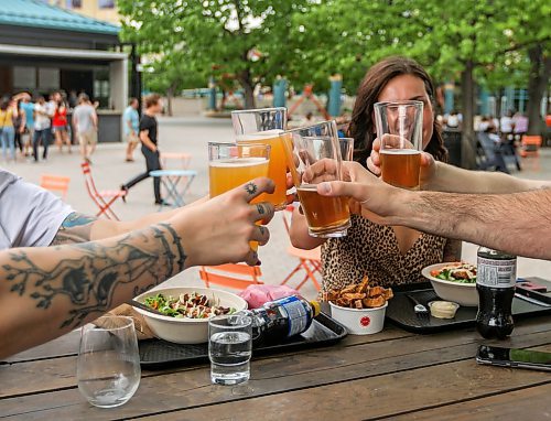SASHA SEFTER / WINNIPEG FREE PRESS
Friends cheers each other as they enjoy a warm evening on The Forks new patio.
190607 - Friday, June 07, 2019.