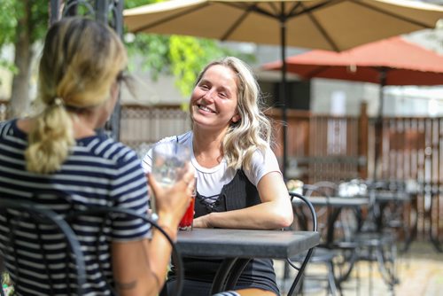 SASHA SEFTER / WINNIPEG FREE PRESS
Courtney Riel enjoys a drink with a friend on the patio of Stellas in the Centre Culturel Franco-Manitobain in Saint Boniface.
190607 - Friday, June 07, 2019.