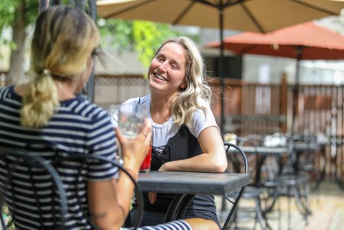 SASHA SEFTER / WINNIPEG FREE PRESS
Courtney Riel enjoys a drink with a friend on the patio of Stellas in the Centre Culturel Franco-Manitobain in Saint Boniface.
190607 - Friday, June 07, 2019.