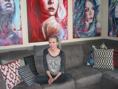 Canstar Community News May 29, 2019 - Headingley artist Rey Fritsch is shown with some of her colourful paintings of female subjects. (ANDREA GEARY/CANSTAR COMMUNITY NEWS)