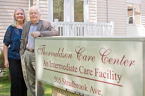 Canstar Community News May 29, 2019 - Jocelyn Thorvaldson and her father Herman Thorvaldson are pictured outside of the intermediate care home they operate on Stradbrook Avenue. The family owned busienss has been serving the community for 60 years and, at 85 years old, Herman continues to help in the day to day operations. Retiring isn't in the cards for the senior who said the opened the facility to "do good," not to be well off. (DANIELLE DA SILVA/SOUWESTER/CANSTAR)