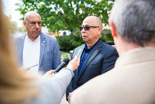 MIKAELA MACKENZIE / WINNIPEG FREE PRESS
John Costa, ATU International president (right), speaks to the media with Aleem Chaudhary, ATU 1505 president, outside of City Hall in Winnipeg on Tuesday, June 11, 2019. For Aldo story.  
Winnipeg Free Press 2019.