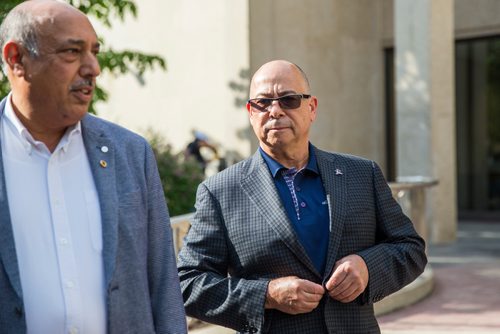 MIKAELA MACKENZIE / WINNIPEG FREE PRESS
John Costa, ATU International president (right), does his jacket up before speaking to the media with Aleem Chaudhary, ATU 1505 president, outside of City Hall in Winnipeg on Tuesday, June 11, 2019. For Aldo story.  
Winnipeg Free Press 2019.