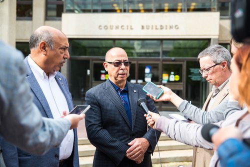 MIKAELA MACKENZIE / WINNIPEG FREE PRESS
John Costa, ATU International president (right), speaks to the media with Aleem Chaudhary, ATU 1505 president, outside of City Hall in Winnipeg on Tuesday, June 11, 2019. For Aldo story.  
Winnipeg Free Press 2019.