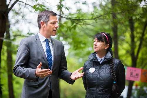 MIKAELA MACKENZIE / WINNIPEG FREE PRESS
Mayor Brian Bowman, along with friends and family who have lost loved ones to addictions and overdose, speaks before planting a memorial garden on Waterfront Drive in Winnipeg on Tuesday, June 11, 2019. For Caitlyn Gowriluk story.  
Winnipeg Free Press 2019.