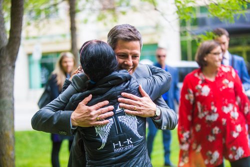 MIKAELA MACKENZIE / WINNIPEG FREE PRESS
Mayor Brian Bowman hugs Arlene Last-Kolb, whose son Jessie passed away due to addictions, before planting a memorial garden for loved ones lost to addictions and overdose on Waterfront Drive in Winnipeg on Tuesday, June 11, 2019. For Caitlyn Gowriluk story.  
Winnipeg Free Press 2019.