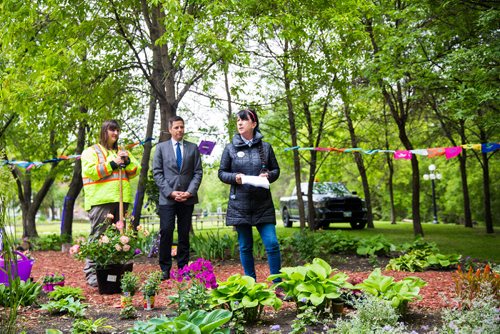 MIKAELA MACKENZIE / WINNIPEG FREE PRESS
Arlene Last-Kolb, who lost her son to addictions, speaks as her daughter and Cit of Winnipeg gardener Nicole Last and Mayor Brian Bowman listen before planting a memorial garden for loved ones lost to addictions and overdose on Waterfront Drive in Winnipeg on Tuesday, June 11, 2019. For Caitlyn Gowriluk story.  
Winnipeg Free Press 2019.