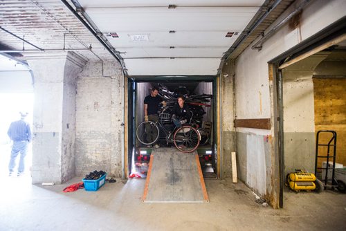 MIKAELA MACKENZIE / WINNIPEG FREE PRESS
Ian Frank (left) and Leigh Anne Parry, co-founders of the Plain Bicycle Project, unload old Dutch bikes in a shipping container in Winnipeg on Tuesday, June 11, 2019. For Alex Paul story.  
Winnipeg Free Press 2019.