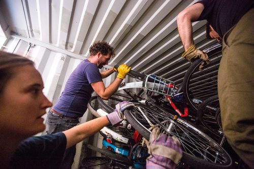 MIKAELA MACKENZIE / WINNIPEG FREE PRESS
Anders Swanson unloads the shipping container full of old Dutch bikes with fellow Plain Bicycle Project co-founders Leigh Anne Parry (left) and Ian Frank in Winnipeg on Tuesday, June 11, 2019. For Alex Paul story.  
Winnipeg Free Press 2019.