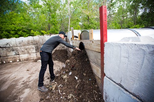 MIKAELA MACKENZIE / WINNIPEG FREE PRESS
Dave Pancoe, manager of special projects at The Forks, demonstrates the composting system at The Forks in Winnipeg on Tuesday, June 11, 2019.  The Forks recently replaced dishware with 100% reusable and compostable products in its path towards a zero-waste goal. For Tessa Vanderhart story.  
Winnipeg Free Press 2019.