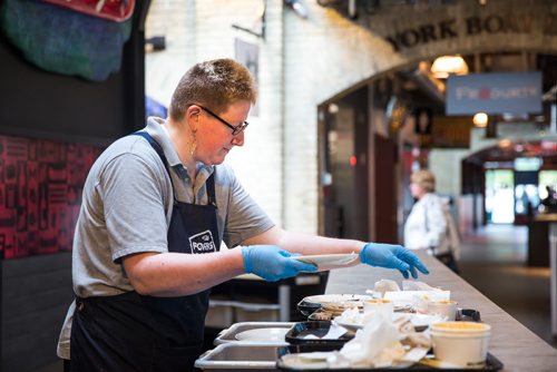 MIKAELA MACKENZIE / WINNIPEG FREE PRESS
Heather Baril, cleaning staff, sorts and scrapes plates at The Forks in Winnipeg on Tuesday, June 11, 2019. The Forks recently replaced dishware with 100% reusable and compostable products in its path towards a zero-waste goal. For Tessa Vanderhart story.  
Winnipeg Free Press 2019.