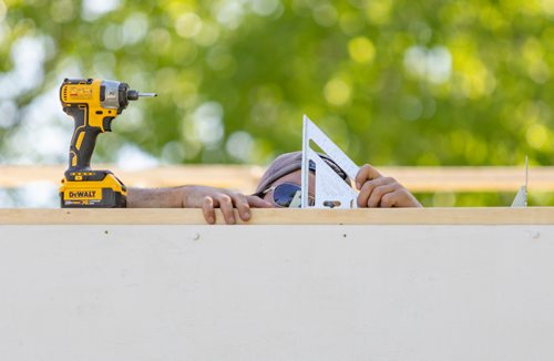 SASHA SEFTER / WINNIPEG FREE PRESS
Patrick Anderson works on the roof of a temporary venue in Parc Elzear Goulet in St. Boniface.
190613 - Thursday, June 13, 2019.